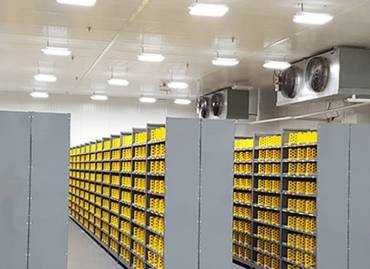 A climate controlled warehousing image with humidity controlled systems attached to the ceiling