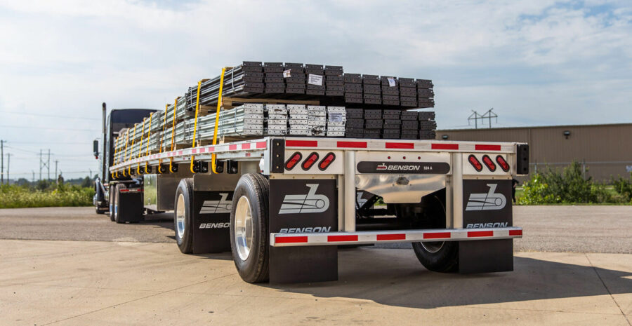 A flatbed trailer with cargo shipping an LTL to Rhode Island. Flatbed provides some benefits over dry van shipping