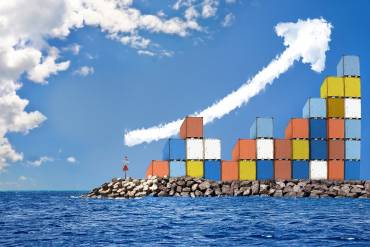 port containers on shore with image depicting inflation and its effect on global supply chain