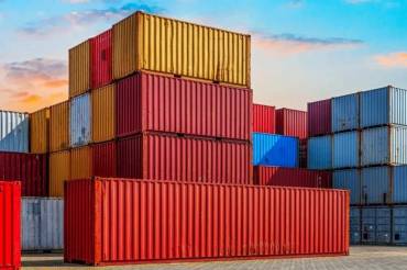 Shipping containers stacked at a transportation company warehouse in Rhode Island