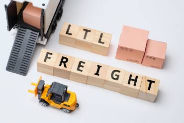 Multi-carrier shipping with fedex, DHL, and UPS shipping packages on a table