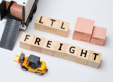 Multi-carrier shipping with fedex, DHL, and UPS shipping packages on a table