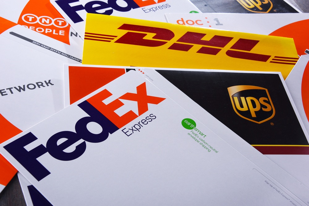 Multi carrier shipping with fedex, DHL, and UPS shipping packages on a table